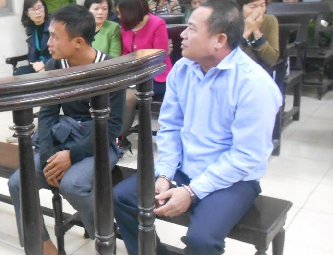 Bị cáo Nguyễn Quang Kỳ (áo xanh) tại phiên tòa phúc thẩm ngày 10/12 (Ảnh: Nguyễn Xinh)