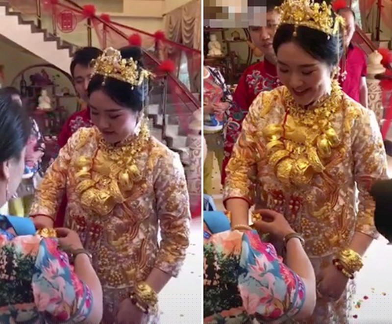 Một cô dâu Trung Quốc đeo chồng chất vàng bạc là những lễ vật thách cưới.   