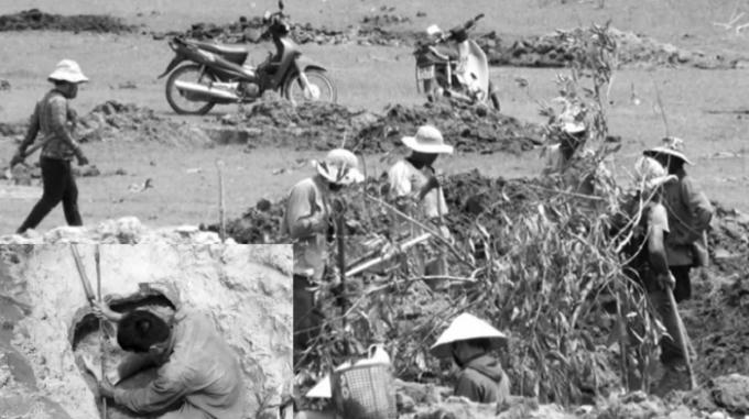 Hàng trăm người dân đổ xô về lòng hồ thủy điện Sông Hinh để đào đá đen.