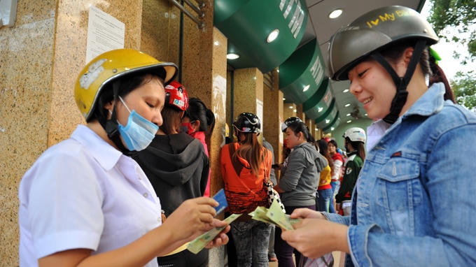 Ngành ngân hàng đã triển khai nhiều biện pháp đảm bảo hệ thống ATM chạy thông suốt phục vụ khách hàng dịp tết Nguyên đán. (Ảnh minh họa)