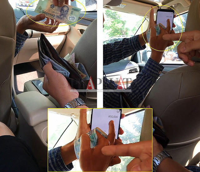 Tài xế taxi dù 51G-503.52 tráo tờ 500.000 đồng của khách thành tờ 20.000 đồng. (Ảnh cắt từ clip) Ảnh: N.TÂN