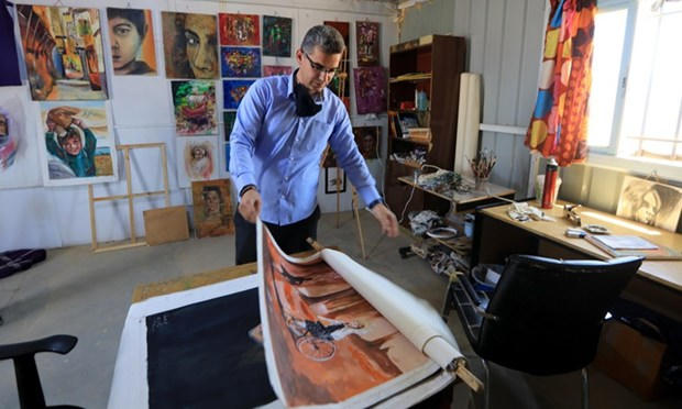 Nghệ sỹ người Syria cho biết anh thường vẽ nên một tương lai tươi sáng và tích cực hơn.(Nguồn: Global Times)