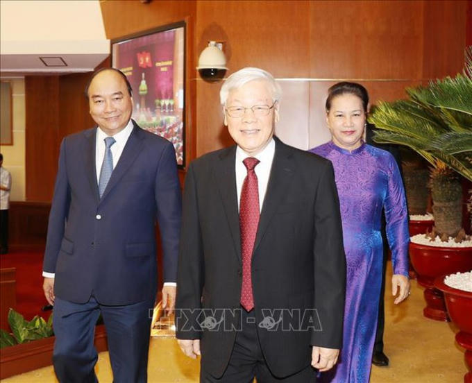 Tổng Bí thư, Chủ tịch nước Nguyễn Phú Trọng cùng Thủ tướng Nguyễn Xuân Phúc và Chủ tịch Quốc hội Nguyễn Thị Kim Ngân đến dự hội nghị. Ảnh: TTXVN