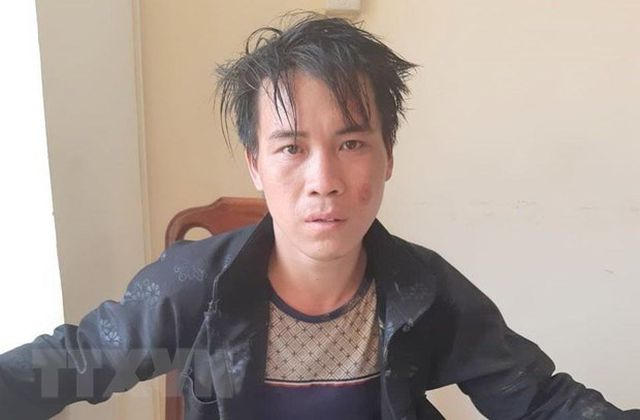 Đối tượng Lù Mí Mua tại cơ quan công an. (Ảnh: TTXVN)