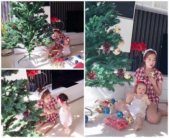 Elly Trần v&agrave; con g&aacute;i Cadie Mộc Tr&agrave; cũng tất bật trang tr&iacute; c&acirc;y th&ocirc;ng Noel.