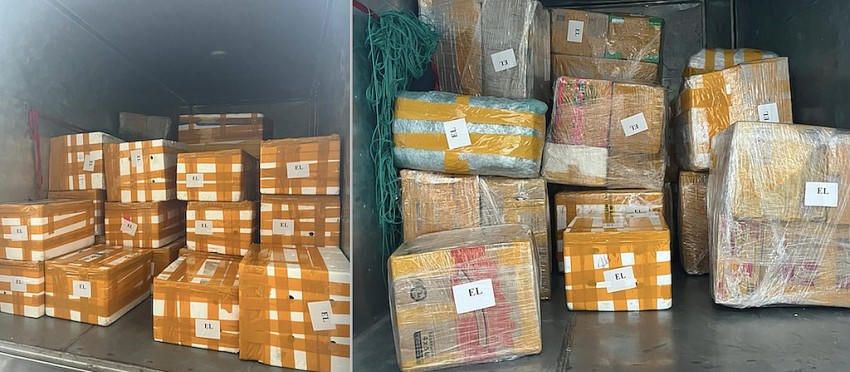 Các kiện hàng được bốc lên xe để đi chuyển vào Đà Nẵng thông qua các công ty trung gian để thông quan.