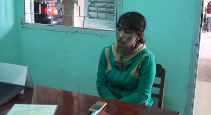 Bà Cao Thị Huyền tại cơ quan công an.