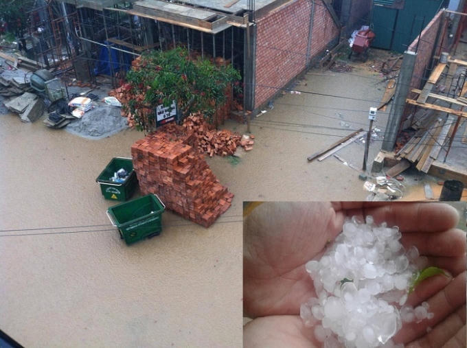 Mưa làm ngập đường, cục đá to bằng ngón tay cái.