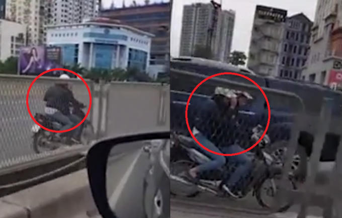 Hai cô gái đi ngược chiều, phóng bạt mạng trên đương trên cao. Ảnh: Cắt từ clip.