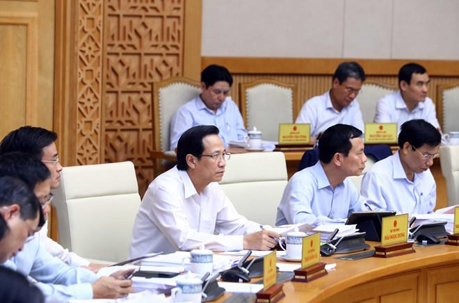 Các thành viên Chính phủ và đại biểu tham dự phiên họp. (Ảnh: Thống Nhất/TTXVN)