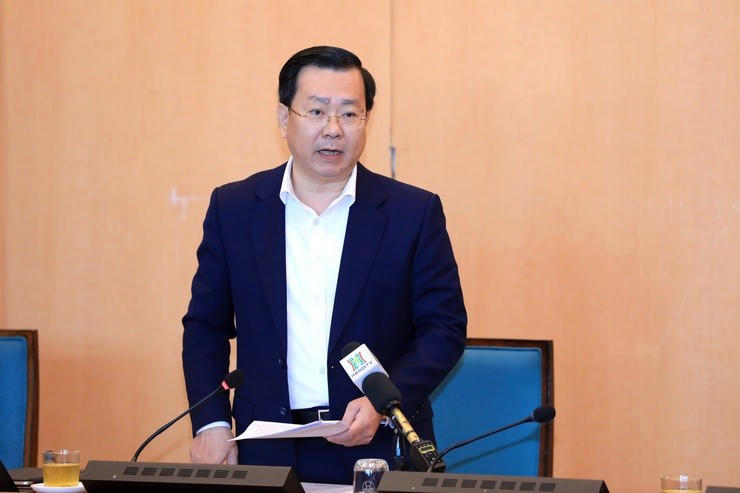 Giám đốc Sở Công Thương Hà Nội Võ Nguyên Phong báo cáo tại cuộc họp. Ảnh: Lê Hải.