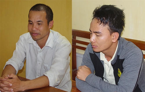 Hai nghi can Tam và Sơn tại cơ quan điều tra. Ảnh: H.G.