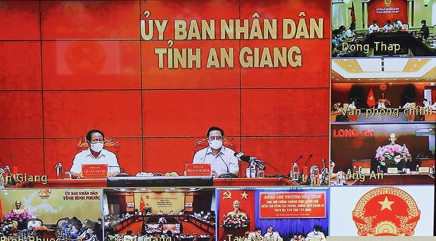 Thủ tướng Chính phủ Phạm Minh Chính chỉ đạo công tác phòng, chống dịch COVID-19 với các tỉnh biên giới phía Tây Nam. (Ảnh: Văn Điệp/TTXVN)