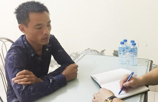 Đỗ Minh Trí tại cơ quan công an.