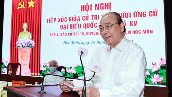 chu_tich_nuoc_nguyen_xuan_phuc_trinh_bay_chuong_trinh_hanh_dong_tai_buoi_tiep_xuc_cu_tri__giso