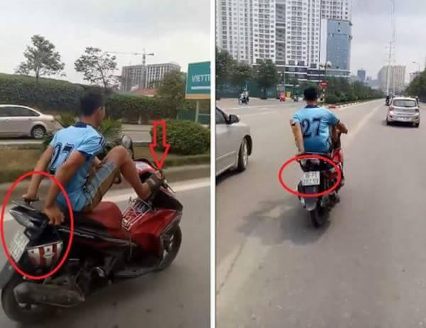 Nam thanh niên không đội mũ bảo hiểm, lái xe bằng chân đi vào đường buýt nhanh BRT.