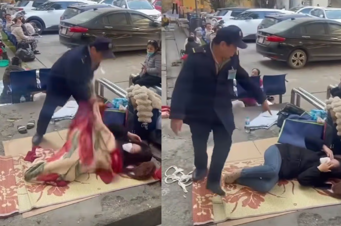 Hành động của bảo vệ Bệnh viện Bạch Mai gây tranh cãi. Ảnh chụp màn hình.