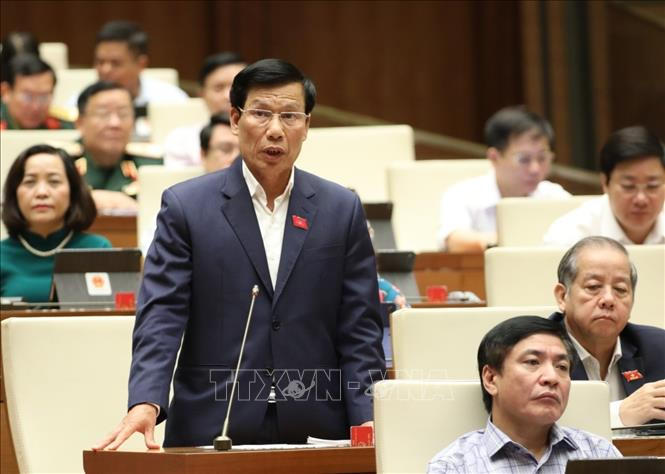 Bộ trưởng Bộ Văn hóa Thể thao và Du lịch Nguyễn Ngọc Thiện phát biểu làm rõ một số vấn đề đại biểu Quốc hội nêu. Ảnh: Văn Điệp/TTXVN