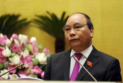 Thủ tướng Nguyễn Xuân Phúc trong phiên trả lời chất vấn tại Quốc hội khóa XIII sáng 13/6/2015 (ảnh: Chinhphu.vn).