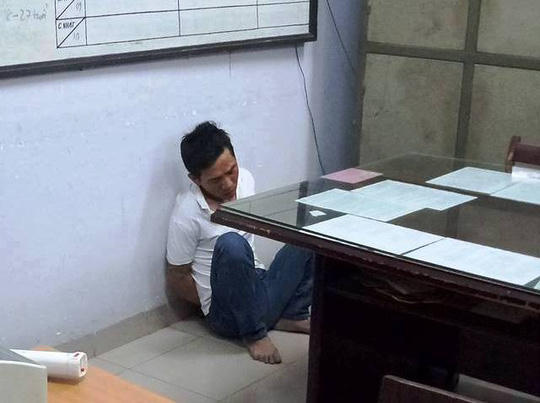 Nghi can Lê Thành Tâm tại cơ quan điều tra ( Ảnh: NLĐO)