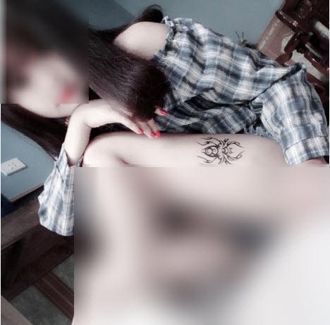 Hình xăm con nhện trên đùi P.T.T.