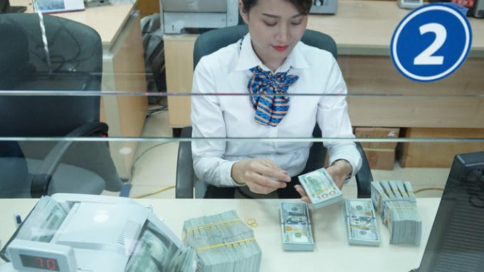 Dự kiến Ngân hàng Nhà nước cũng sẽ sớm có định hướng về chính sách tín dụng ngoại tệ, để doanh nghiệp chủ động nắm bắt, trước khi cơ chế kết thúc theo thông tư gần nhất đang áp dụng - Ảnh: Quang Phúc.