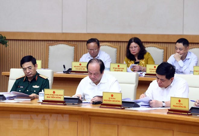 Các thành viên Chính phủ và đại biểu tham dự phiên họp. (Ảnh: Thống Nhất/TTXVN)