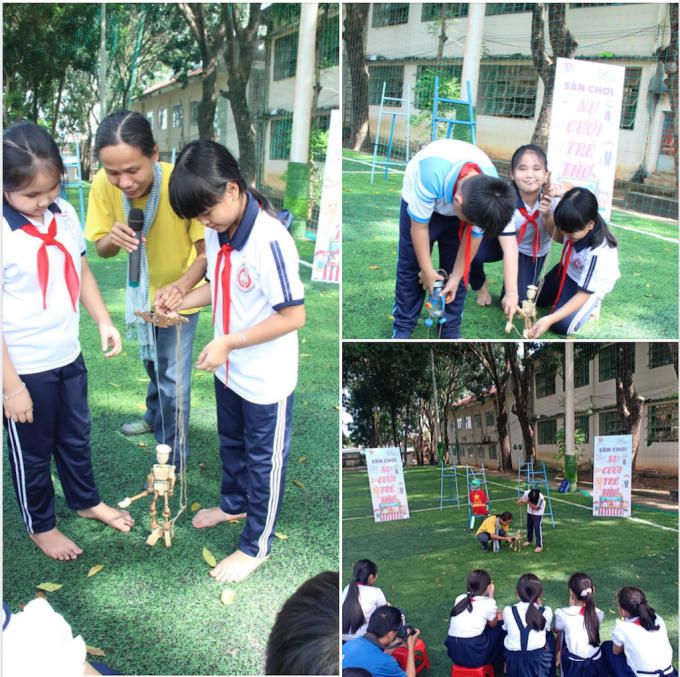 Anh Phan Tuấn Quốc (áo thun vàng) - Trưởng nhóm Mekongaholics (Nhóm Nghiên cứu văn hóa cộng đồng Việt Nam - ASEAN) tận tình hướng dẫn cho các em thiếu nhi làm quen và điều khiển rối dây