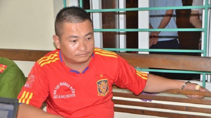 Nguyễn Hữu Tùng tại cơ quan công an.