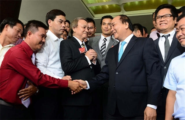 Thủ tướng Nguyễn Xuân Phúc trong cuộc gặp doanh nghiệp năm 2016   Ảnh: Theo VietNamFinance