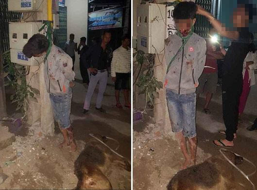 Hình ảnh nam thanh niên bị treo lên cột điện.