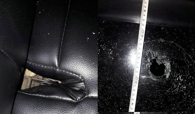 Lực lượng chức năng xác định kính ô tô vỡ do bị bắn bằng súng cao su.
