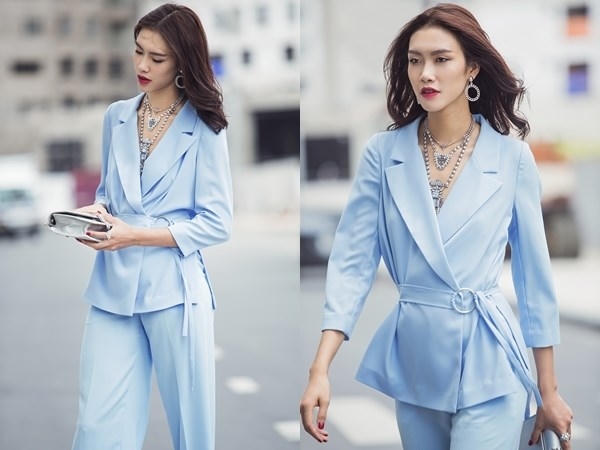 Chân dài Nguyễn Oanh làm dịu mùa hè nóng bức bằng bộ đồ màu xanh phấn đẹp mắt, được mix khéo léo với trang sức đính đá, càng làm tăng vẻ kiêu kỳ.