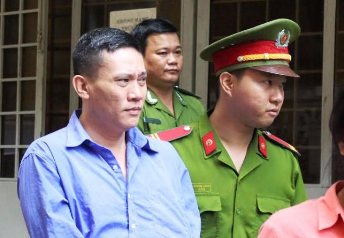 Bị cáo Lộc bị dẫn giải sau phiên tòa.