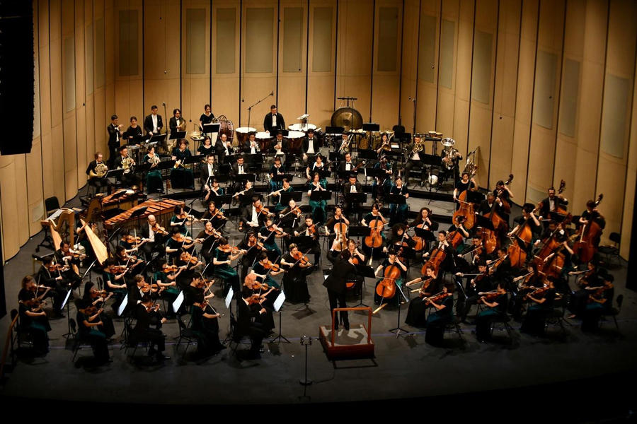 A group of people playing instruments

AI-generated content may be incorrect.