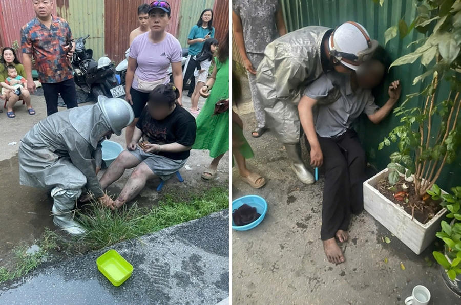 Lực lượng chức năng giải cứu những người mắc kẹt trong ngôi nhà phát hỏa. Ảnh: CA Hà Nội.